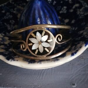 Gold and Black Intricate Bracelet with Geometric Patterns